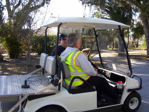 Linda, K8LCC, and marathon volunteer Paul, patrolling the course for potential injuries or illness amongst the runners